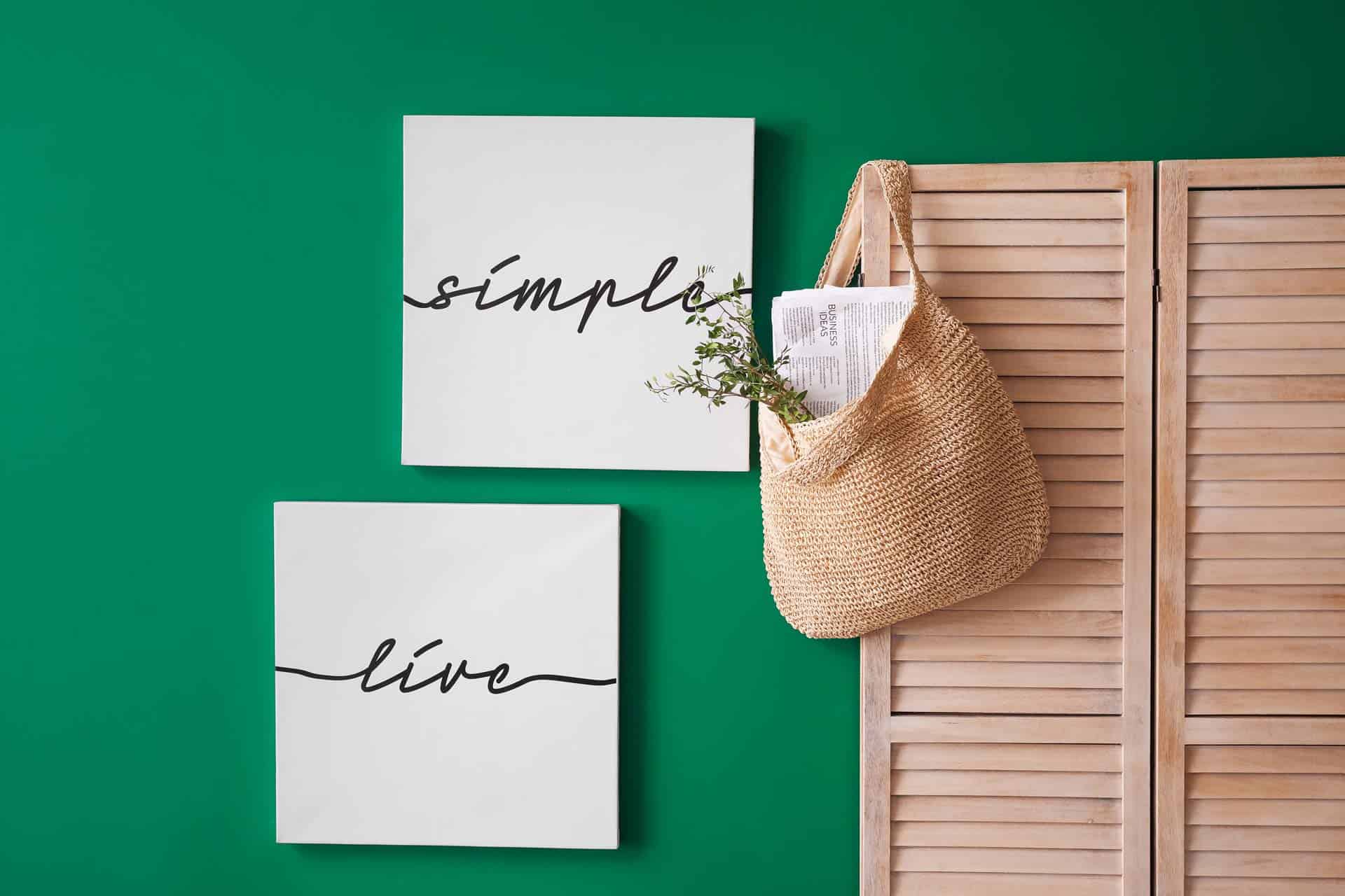 Wood screen and green wall with text about benefits of simplifying your life