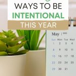 Two small plants and calendar on table, with text overlay - "7 easy ways to be intentional this year".